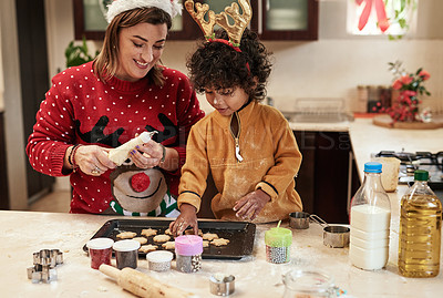 Buy stock photo Woman, child and baking with christmas, snack and dough learning for cookies in kitchen together. Smile, food and celebration with mother, adopted son and boy in home to prepare sweet treat or love