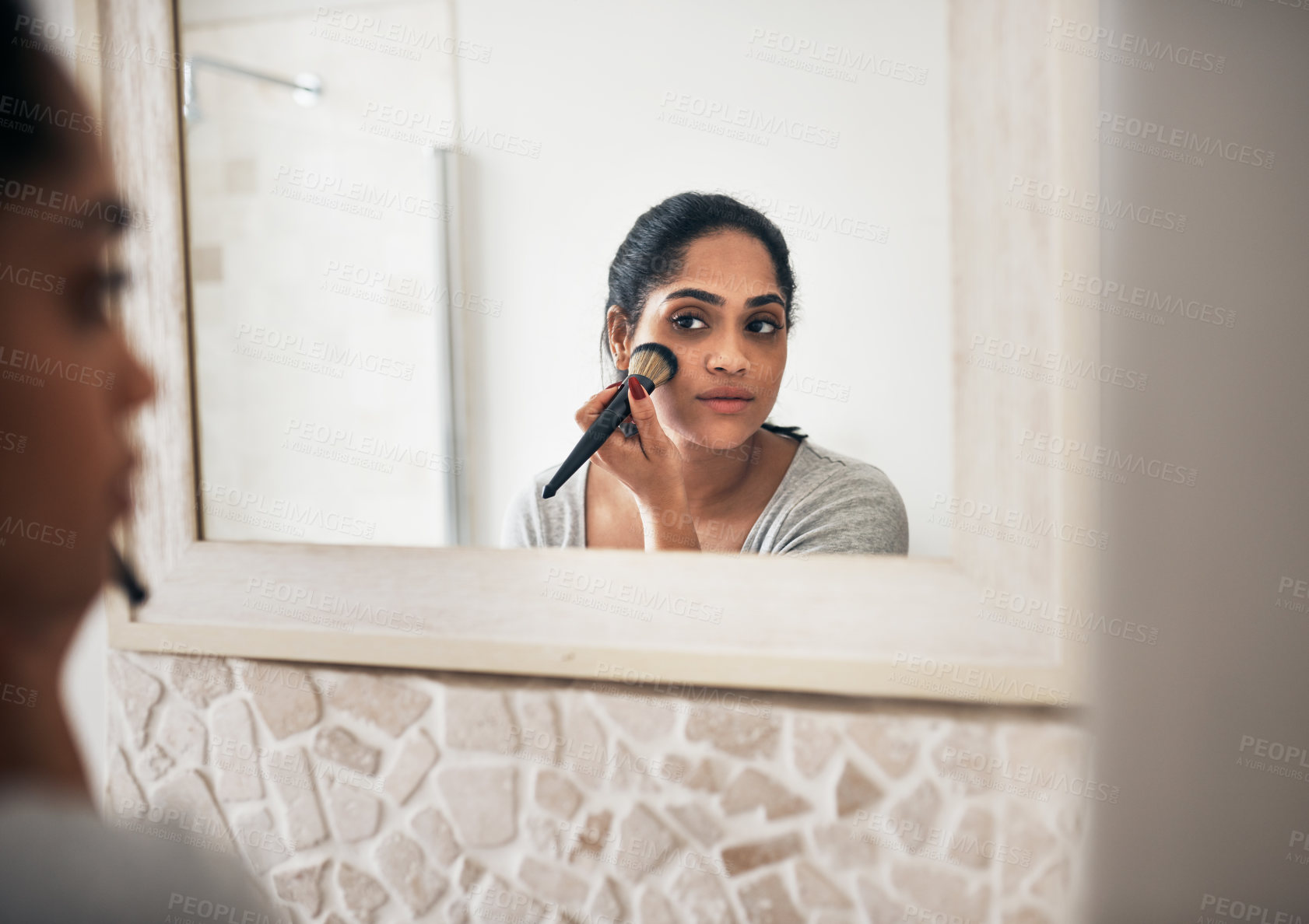 Buy stock photo Woman, makeup brush and skincare in mirror of bathroom for morning routine, getting ready and self care. Person, beauty and apply cosmetics product to face for foundation, glamour or glow application