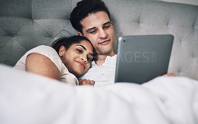 Buy stock photo Shot of a woman covering her boyfriend's eyes while surprising him with a gift