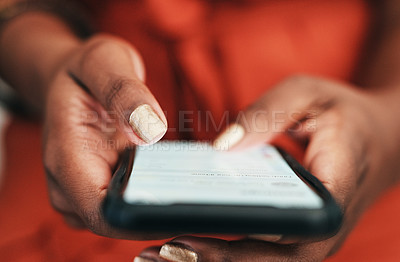 Buy stock photo Cropped shot of an unrecongnizable businesswoman sitting alone in the office and texting on her cellphone