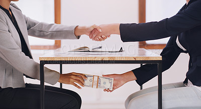 Buy stock photo Hand shake, bribe under table and cash with business women with bad practice for deal, agreement and secret. Financial crime partnership, dirty money laundering and shaking hands with lawyer at desk