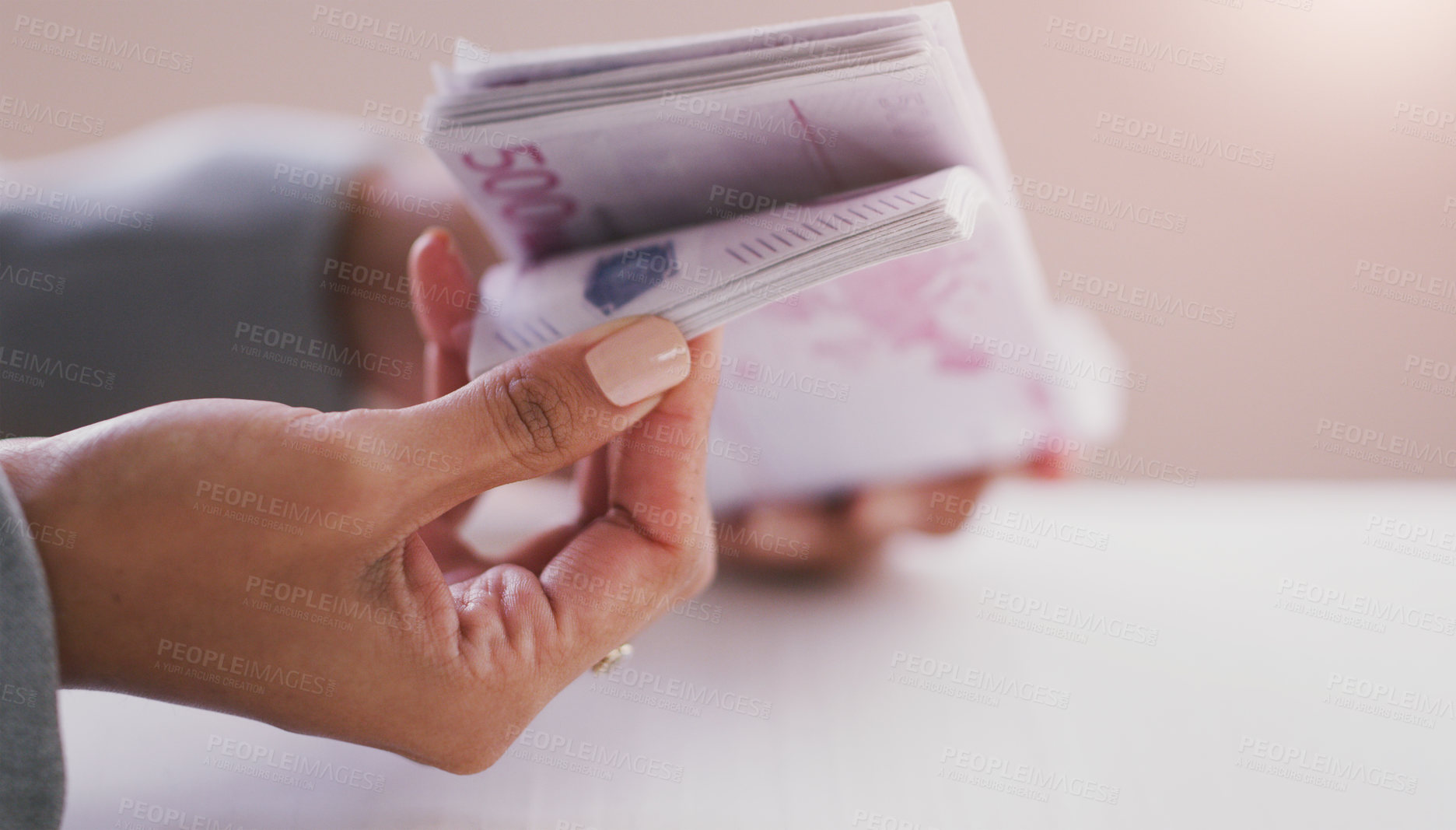 Buy stock photo Cropped shot of an unrecognizable businesswoman counting a stack of money in her office during the day
