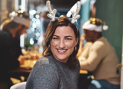 Buy stock photo Portrait of a cheerful young woman wearing a festive hat at home during christmas time