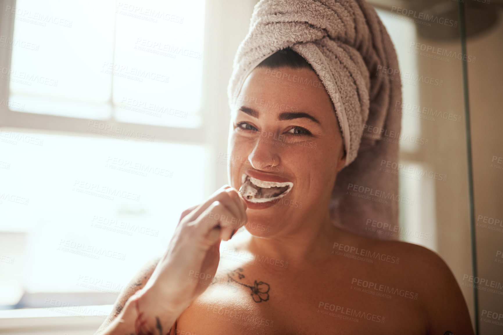 Buy stock photo Happy woman, portrait or brushing teeth in bathroom for oral care, dental hygiene or clean routine. Girl, smile or towel in home for health, fresh breath or plaque control with eco friendly product