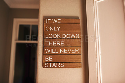Buy stock photo Shot of a motivational quote hanging on a wall