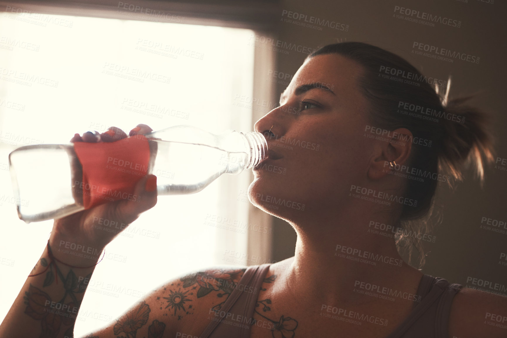 Buy stock photo Fitness, drinking and woman with water in home with break for workout, training or health challenge. Sports, wellness and female person enjoying drink for natural hydration on detox or diet at house.