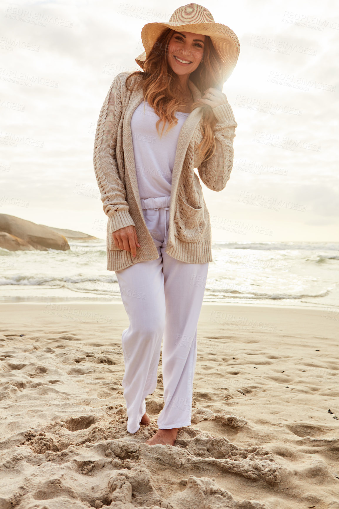 Buy stock photo Portrait of a young woman spending some time at the beach