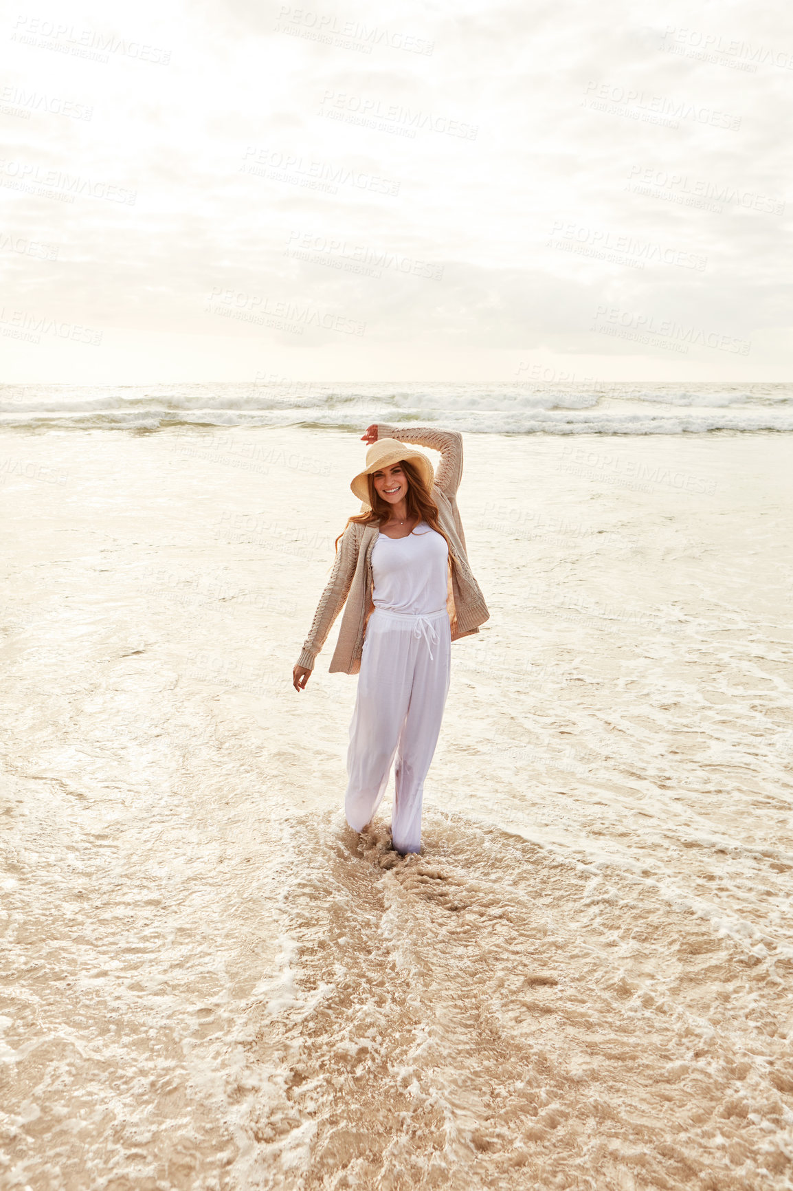 Buy stock photo Portrait of a young woman spending some time at the beach