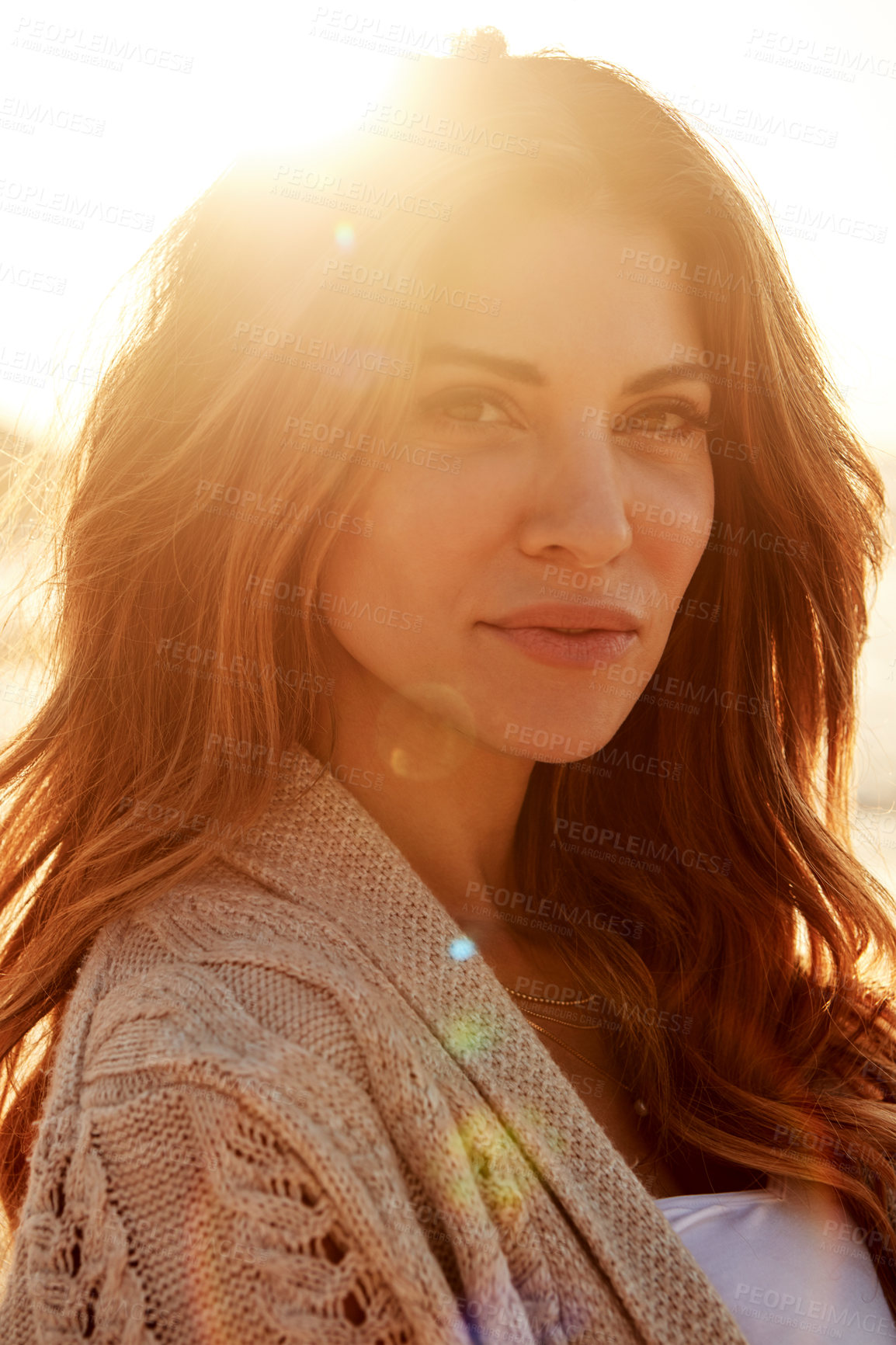 Buy stock photo Portrait of a young woman spending some time at the beach