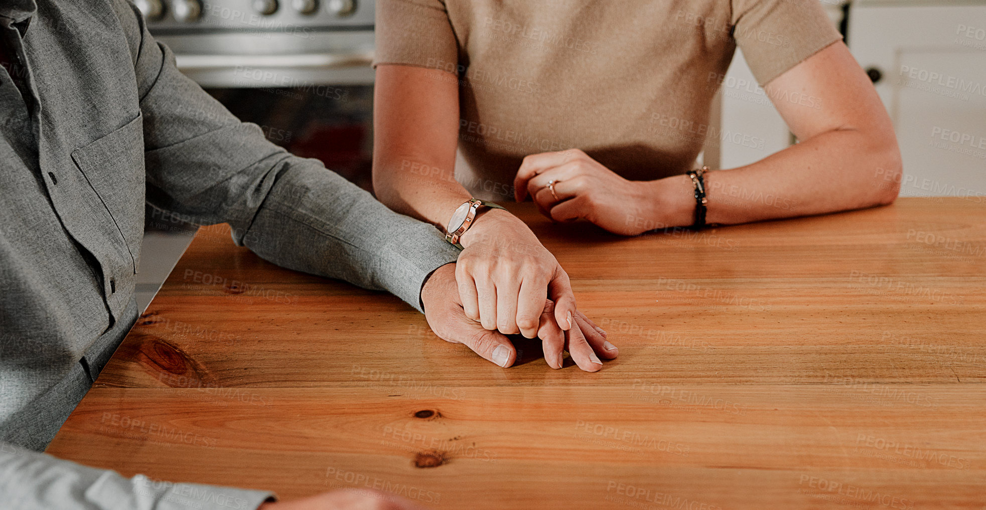 Buy stock photo Support, holding hands and couple with marriage, home and mental health problem zoom on table for help, trust and love. Sad people hand holding for depression, death or bad news with care and empathy