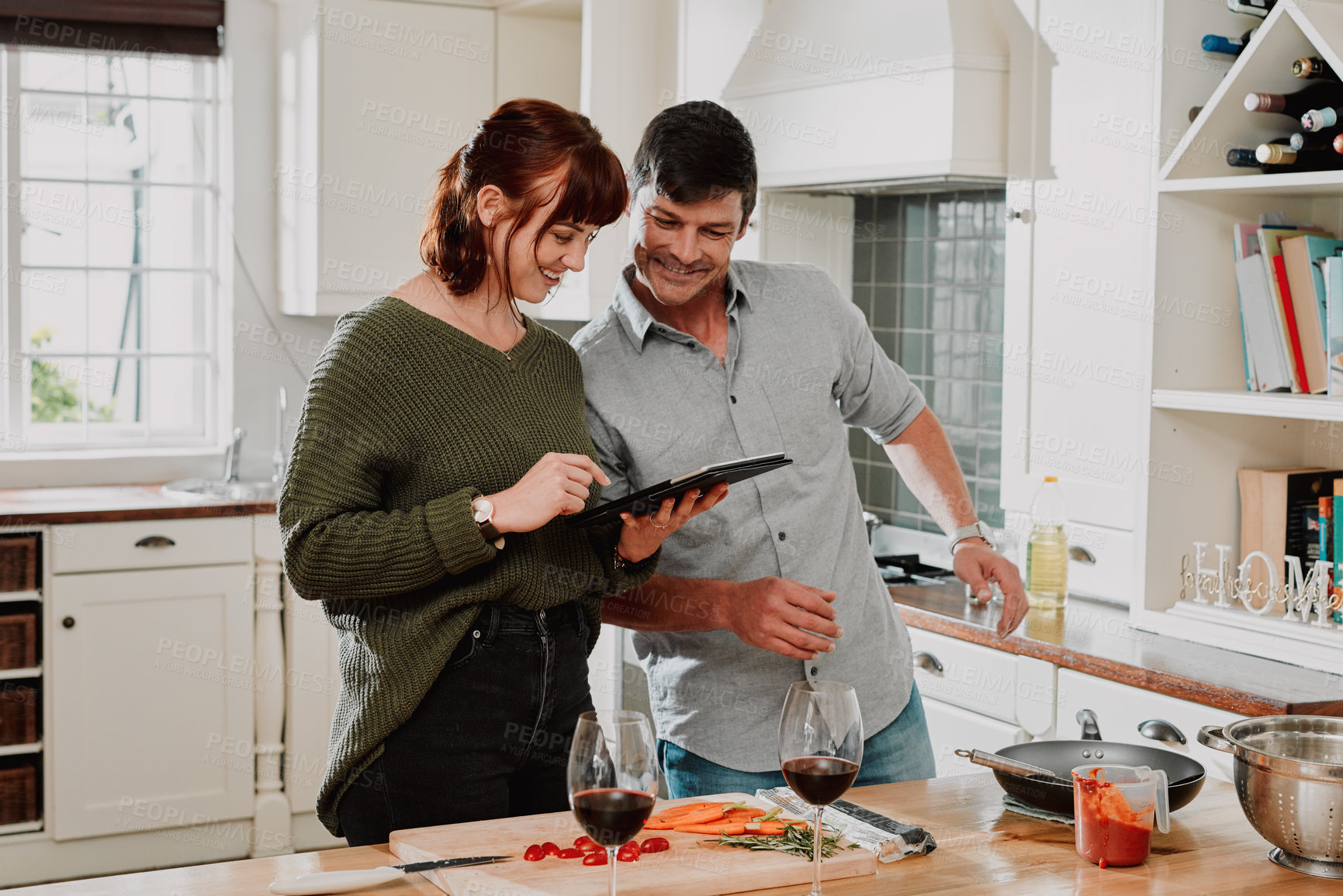 Buy stock photo Home, cooking and couple with tablet, typing and internet for recipe, online video and social media. Apartment, man and woman in kitchen, technology and digital app with ingredients and connection