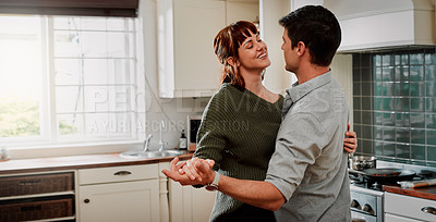 Buy stock photo Cropped shot of a happy couple slow dancing at home
