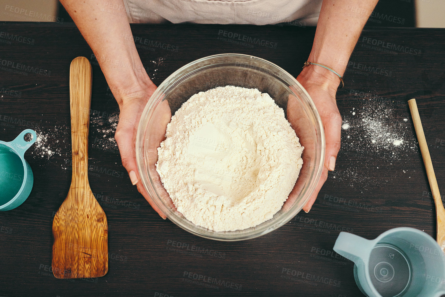 Buy stock photo Woman, hands and bowl of flour for baking above with ingredients or recipe on kitchen counter at home. Top view of female person or baker hand holding mixture or batter for delicious pastry in house