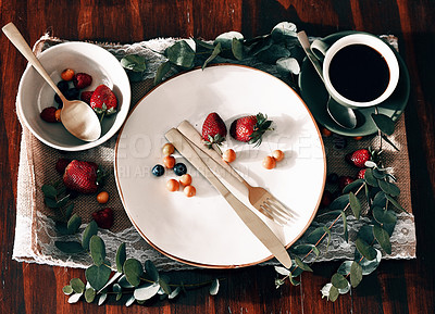 Buy stock photo High angle shot of a neatly organised tray with coffee; berries on a plate and in a bowl