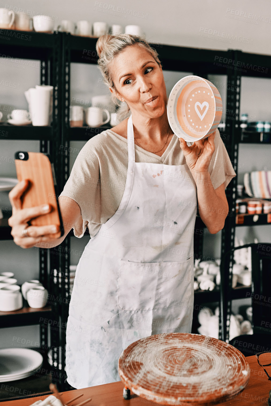 Buy stock photo Happy woman, pottery and selfie in small business for social media, advertising or fun vlog at store. Female person or retail owner with tongue out and clay bowl for funny photo or post on smartphone