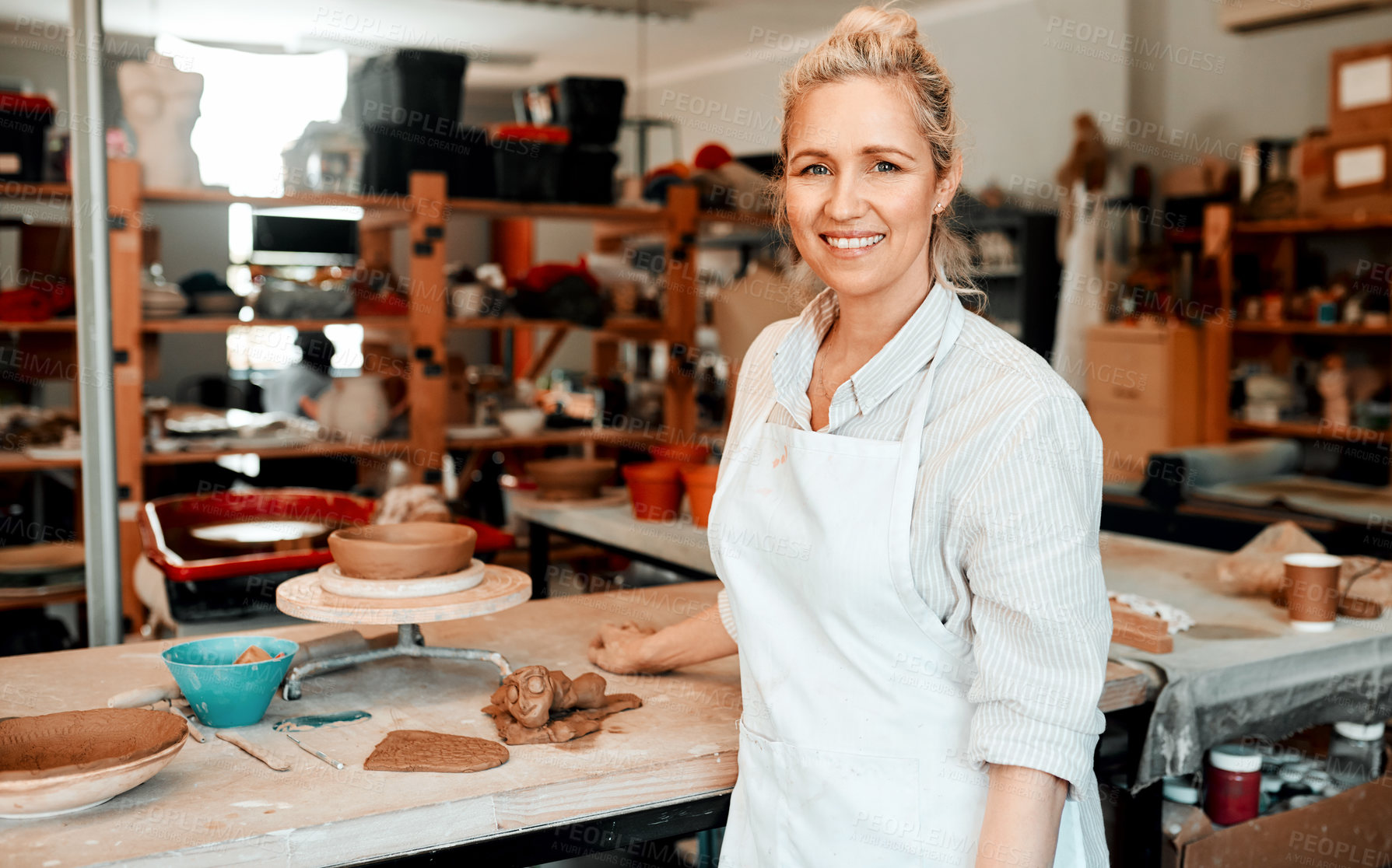 Buy stock photo Portrait of a female artisan standing in her pottery workshop