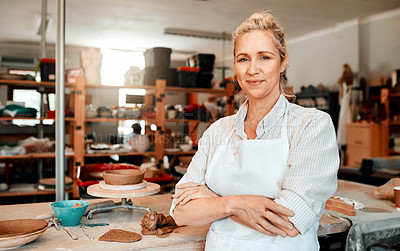 Buy stock photo Portrait of a female artisan standing in her pottery workshop