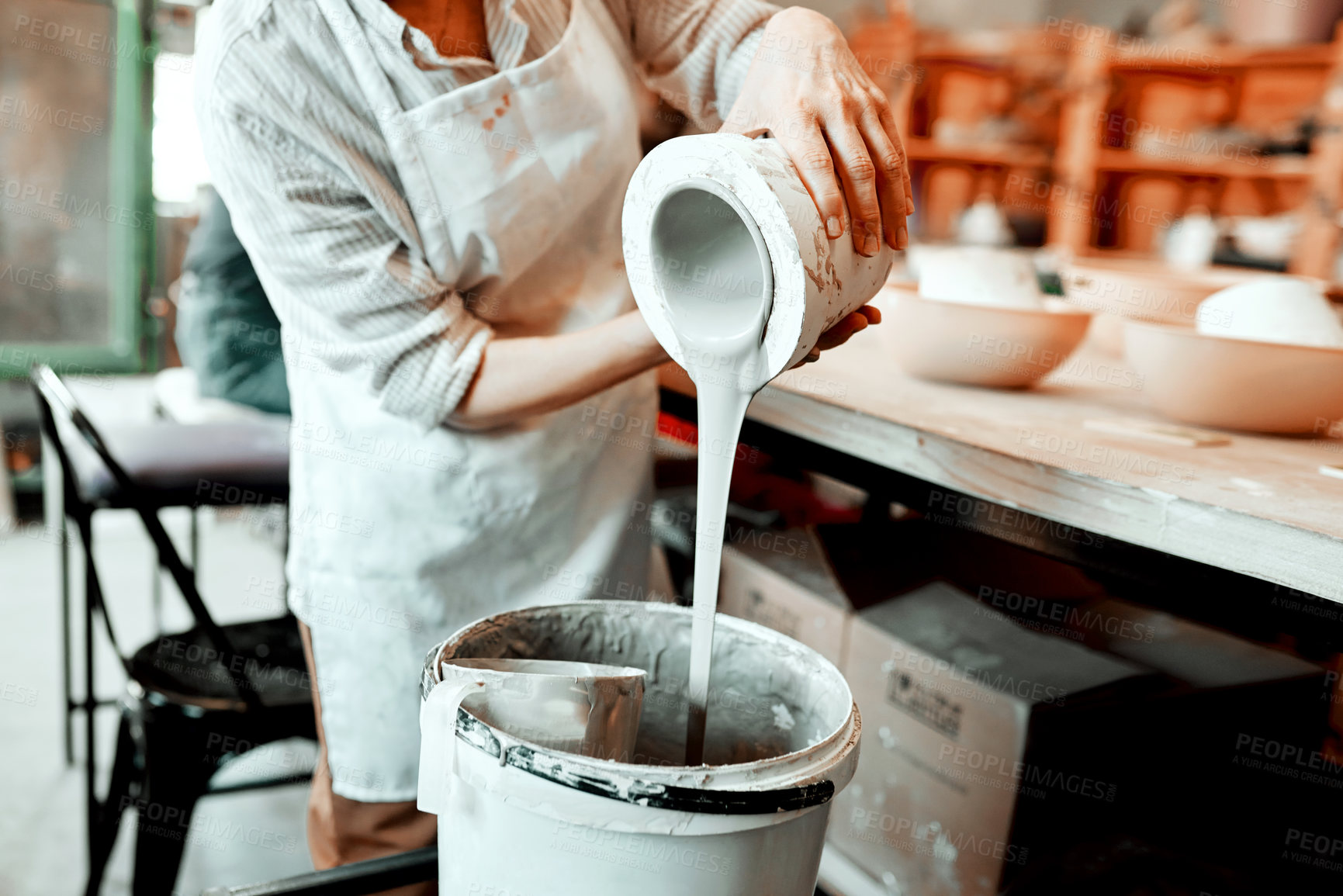 Buy stock photo Woman, glaze and pottery container in studio for ceramic, shape and craft with easy application. Artist, bowl and cleaning or mixing slip as potter in workplace for creative art, process and handmade