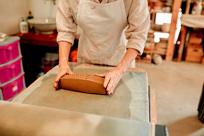 Buy stock photo Potter, hands and clay on table in workshop for handmade craft and production process for ceramics. Pottery manufacturing, entrepreneur and small business for creative design and artistic sculpture