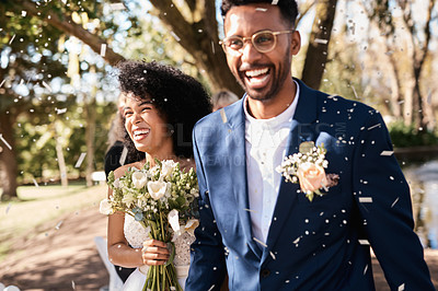 Buy stock photo Wedding day, couple and confetti outdoor with happiness and smile from marriage event. Celebration, African people and bride walking with flower bouquet at love and trust commitment ceremony