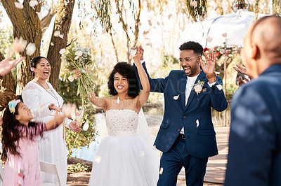 Buy stock photo Wedding day, couple celebrate and confetti outdoor with happiness and hands up at marriage event. Celebration, happy people and African bride walking with flower bouquet at love commitment ceremony