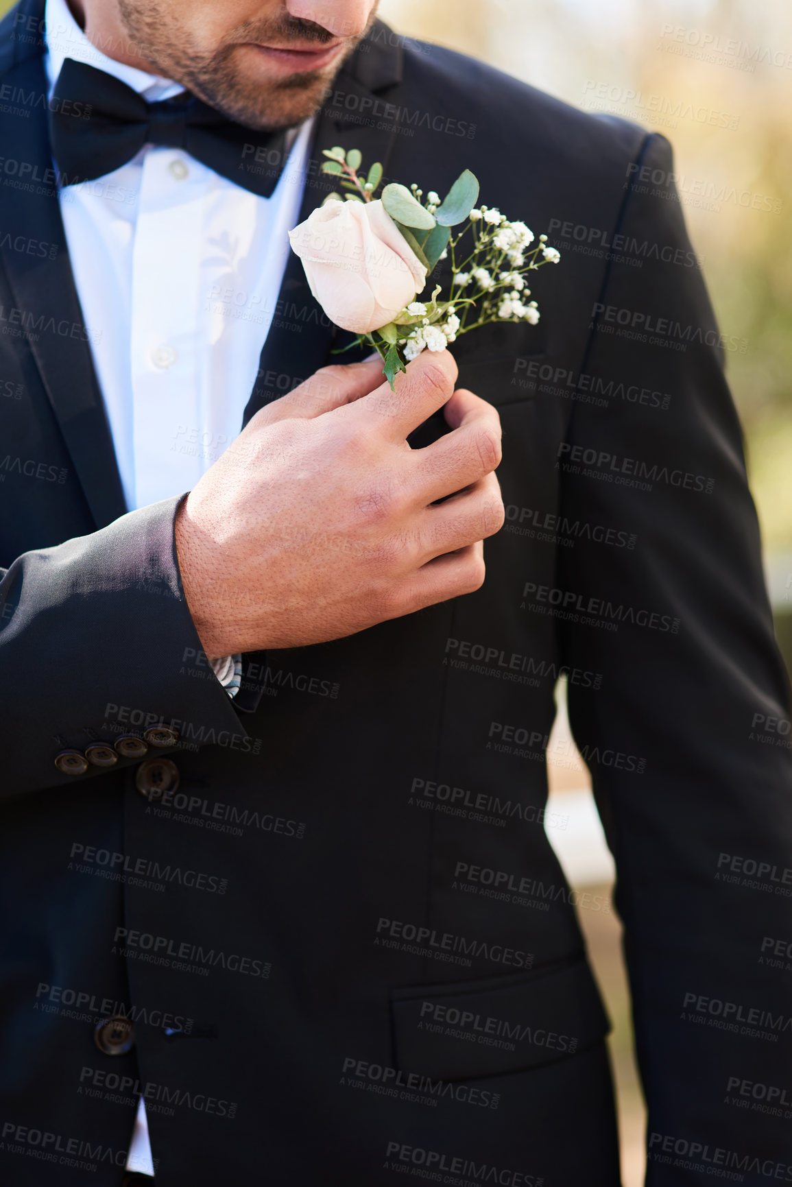 Buy stock photo Man, groom and flower on suit for wedding day or boutonniere for loving commitment, marriage or event. Male person, hand and fashion jacket with milestone party in garden park, ceremony or formal