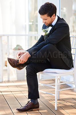 Buy stock photo Man, groom and shoelace for wedding day marriage or dressing formal for commitment, celebration or outdoor. Male person, chair and boutonniere at summer reception or love party, ceremony or milestone