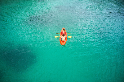 Buy stock photo Top view, adventure and couple with ocean, canoeing and summer vacation with getaway, break and bonding. Partners, man or woman with a canoe, water and seaside holiday with kayak, tropical and travel