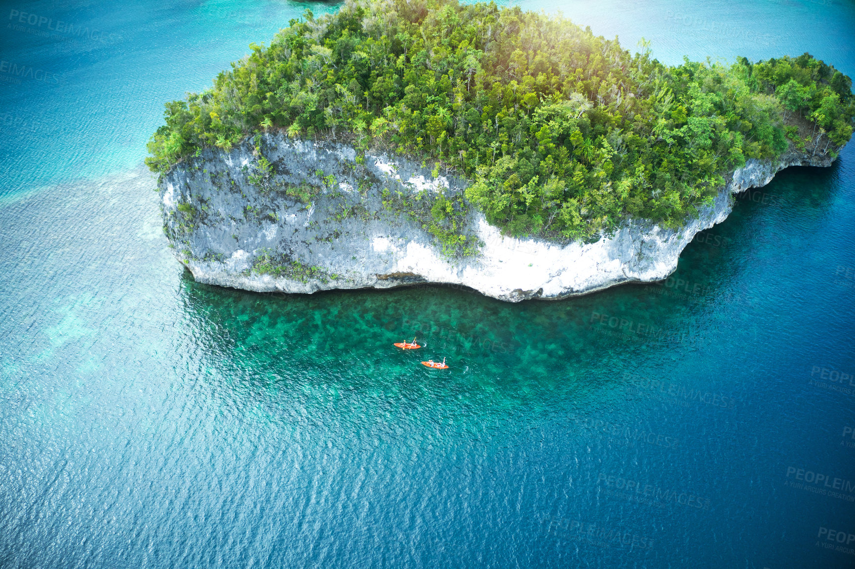 Buy stock photo Drone, island and water adventure with people in kayak for travel, freedom and fun in nature. Top view, paradise and friends canoeing in Indonesia, relax and zen, peace or beautiful outdoor scenery 