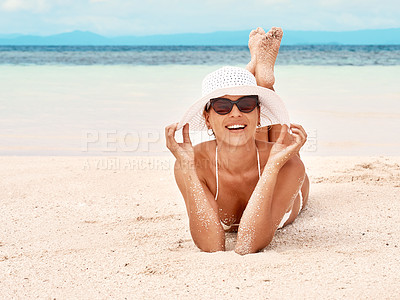 Buy stock photo Portrait of a beautiful young woman relaxing on the beach