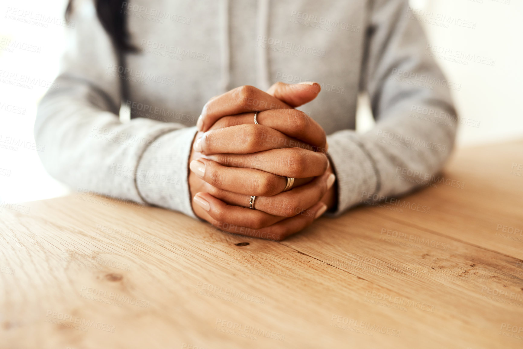 Buy stock photo Hands, woman and praying to God at table in home with faith, religious worship and devotion to Christianity. Person, spiritual gratitude and praise Jesus for forgiveness, holy connection and trust