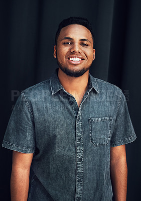 Buy stock photo Happy portrait, pride and black man in studio for happiness, posing and fashion style against dark black background. Smile, denim and face of an African model with stylish clothes on dark background