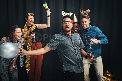 Buy stock photo Friends, dancing and drinks at a party to celebrate Christmas, new years or birthday with energy, happiness and fun at staff event. Men and women people at celebration with alcohol and funny dance