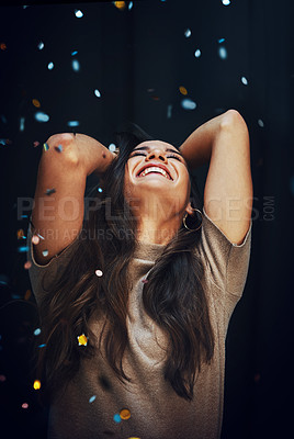 Buy stock photo Party, confetti and dance with a woman in studio on a dark background for celebration of the new year. Birthday, music and energy with a happy female celebrating at a disco or event for fun