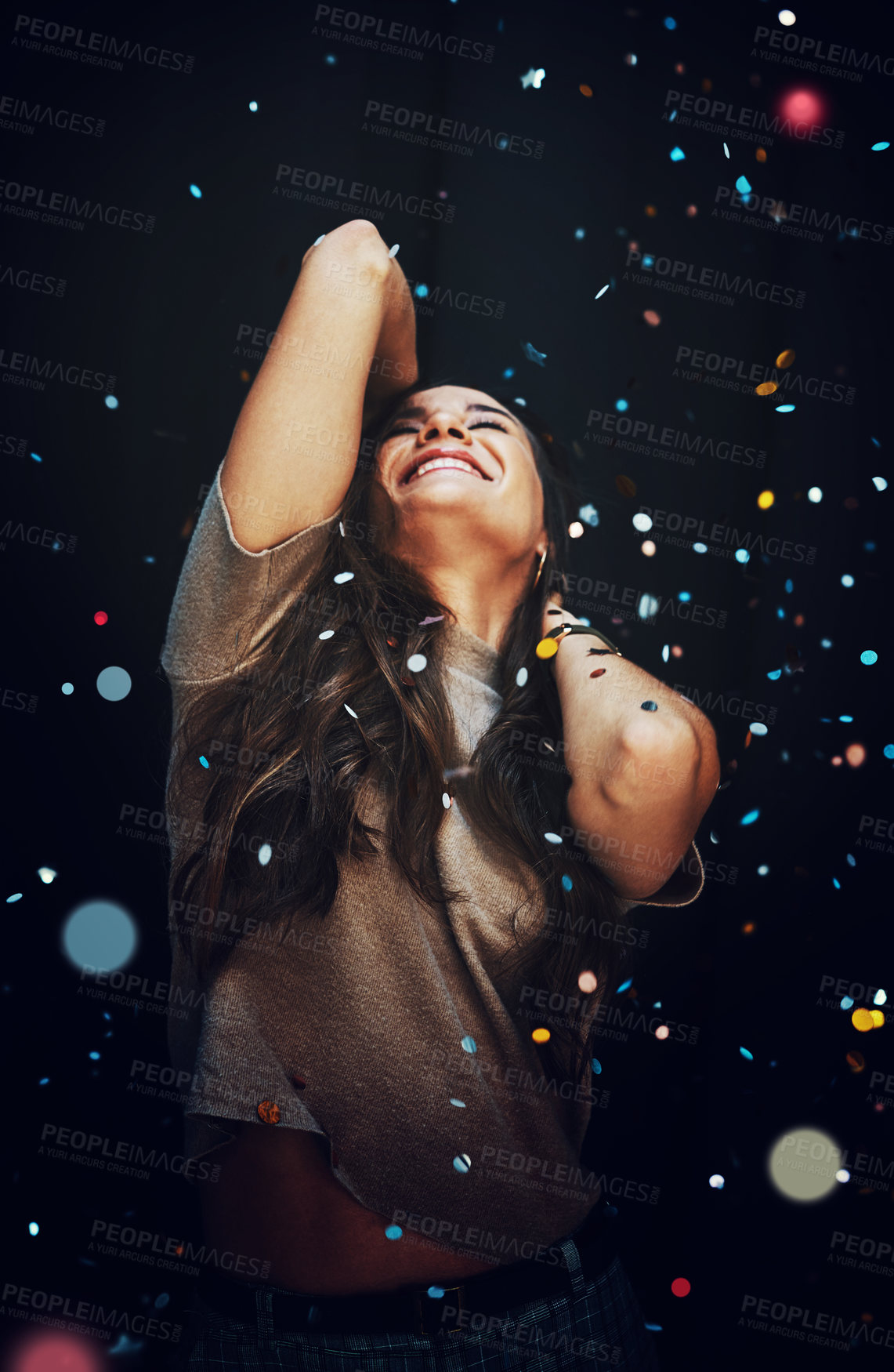 Buy stock photo Party, confetti and celebration with a woman in studio on a dark background for a new year event. Birthday, energy and smile with a happy young female on a black backdrop for a nightlife social