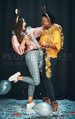 Buy stock photo Women friends, party and night with balloons, tinder or wine in new year, celebration or happiness. Woman diversity, hug and glass for drinks, happy or dark background for glitter confetti on floor