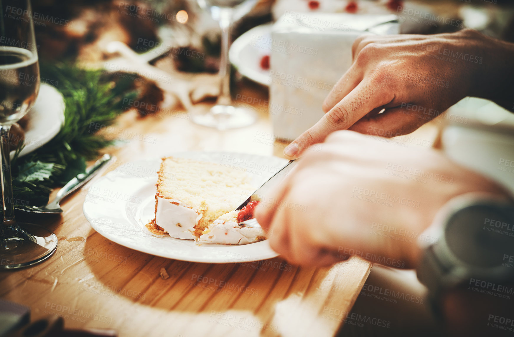 Buy stock photo Cropped shot of an unrecognizable man having cake while sitting at a table at Christmas