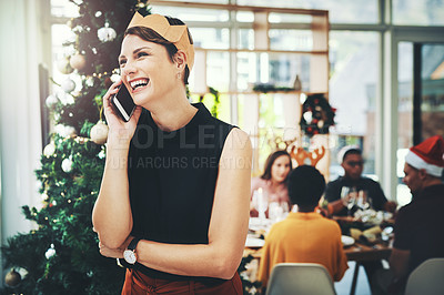 Buy stock photo Cropped shot of an attractive young woman taking a phonecall with her friends dining in the background
