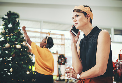 Buy stock photo Cropped shot of an attractive young woman looking concerned while taking a phonecall on Christmas day at home