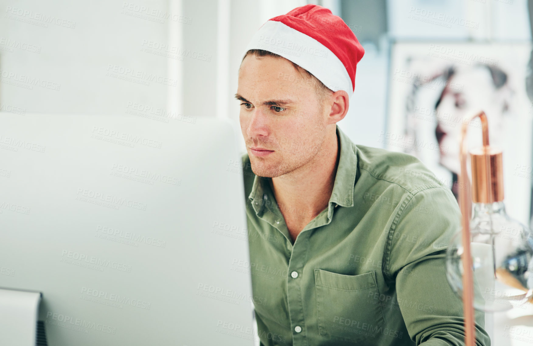Buy stock photo Businessman, computer and working with christmas hat in office at digital marketing job on internet. Man, holiday and work on pc, web or online with festive clothes, celebration or focus in workplace