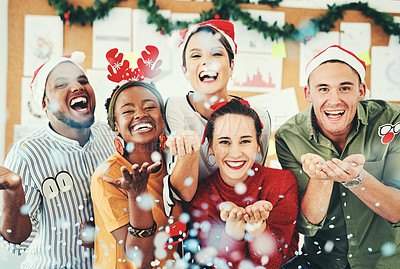 Buy stock photo Christmas, office and business people blowing confetti and having fun together. Portrait, xmas party or group of happy employees, workers or coworkers celebrating with paper decorations in workplace
