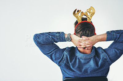 Buy stock photo Businessman, relax and christmas reindeer antlers on office mockup background, company wall space or small business startup. Creative designer, hands behind head and done with festive season success