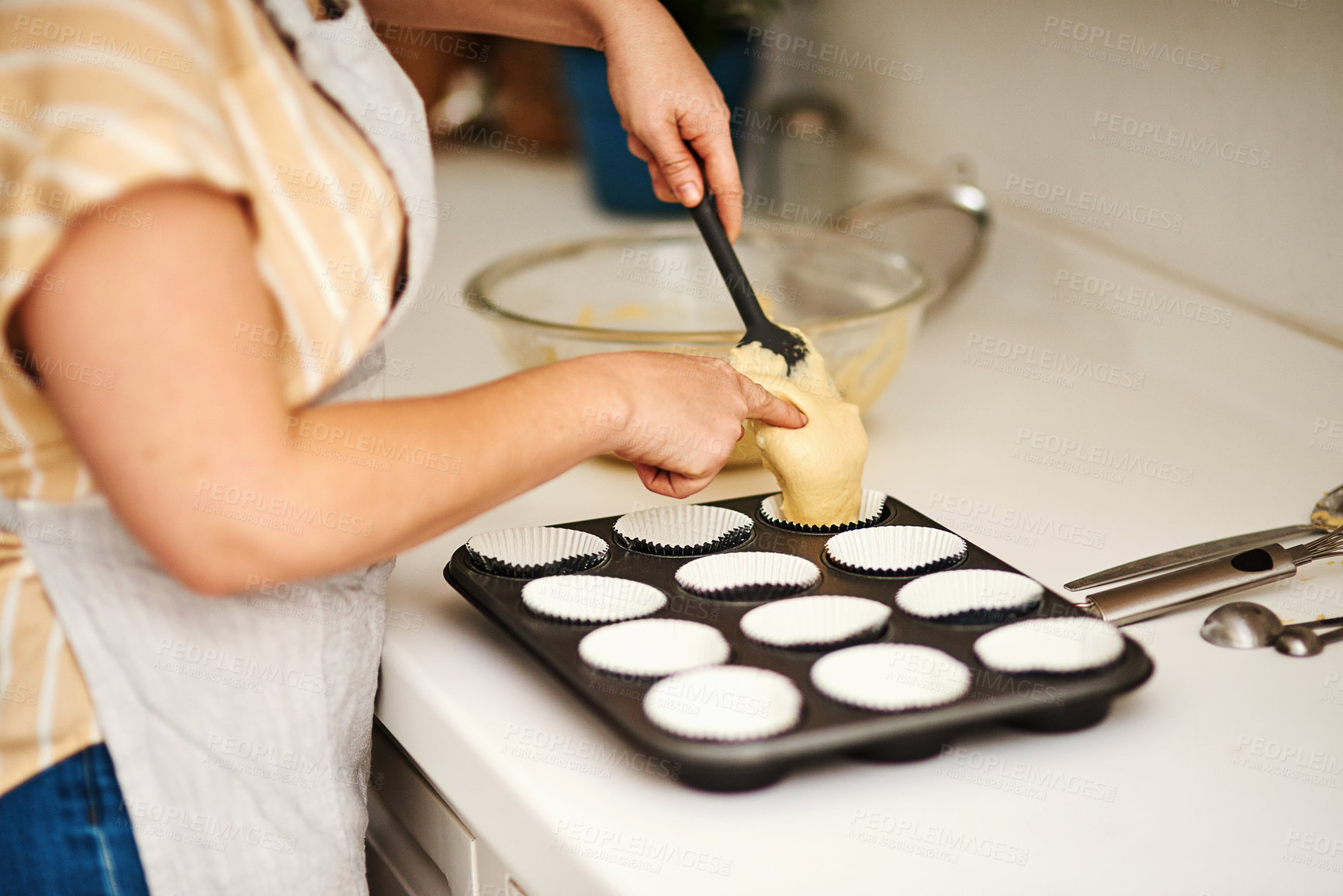 Buy stock photo Cupcakes, baking tray and cake batter for prepare in kitchen or house for relax with therapeutic hobby. Cooking, dessert and professional person for small business or home recipe with hands in job.