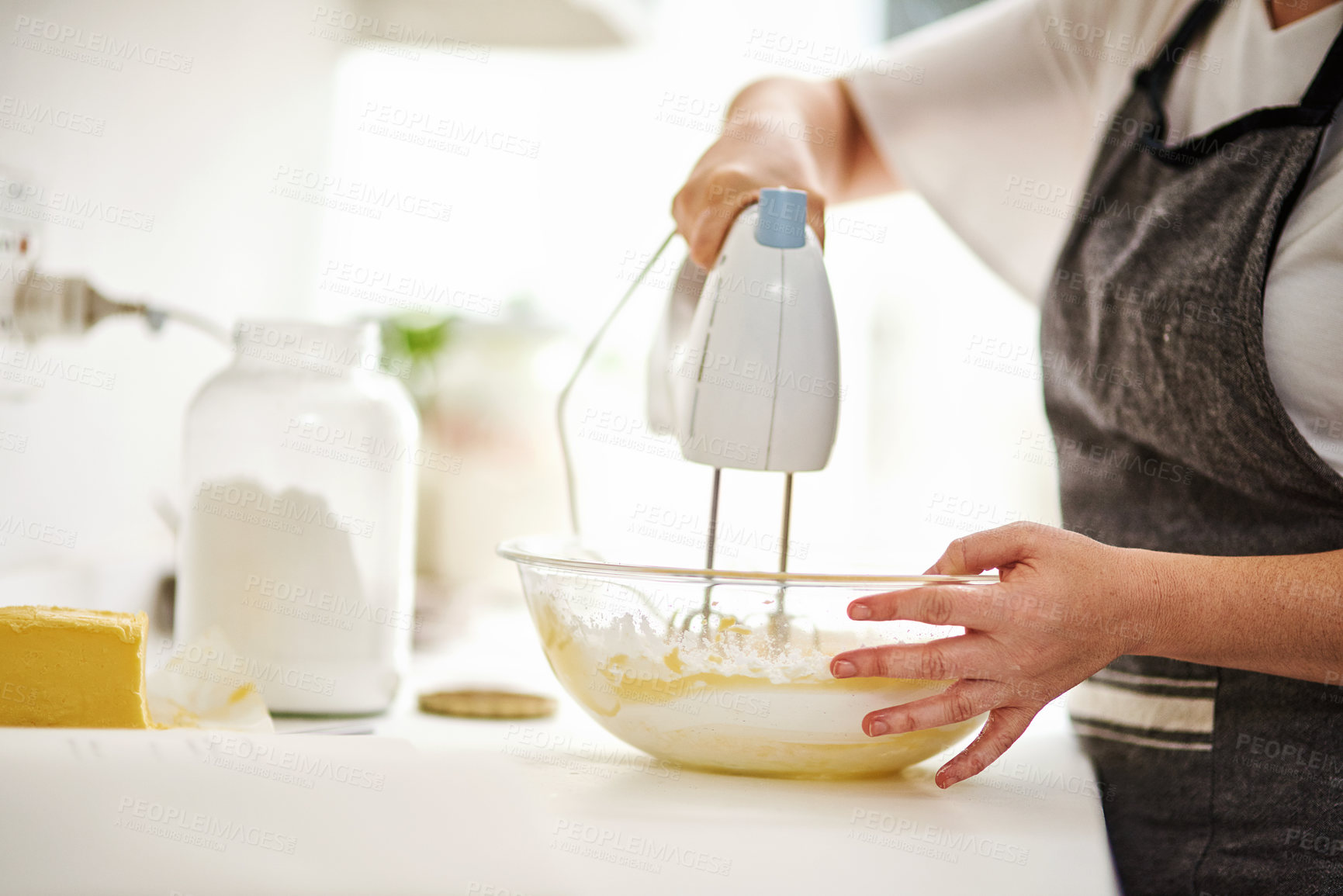 Buy stock photo Bowl, hands and mixer for baking with person in kitchen of home closeup for pastry preparation. Batter, cooking and food with baker or chef at counter of apartment for mixing dough and flour