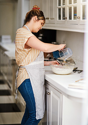 Buy stock photo Woman, kitchen and measurement for baking, home and glass bowl for dessert or small business. Baker, ingredients and mixing with spatula, house or startup bakery for recipe prepare and food process