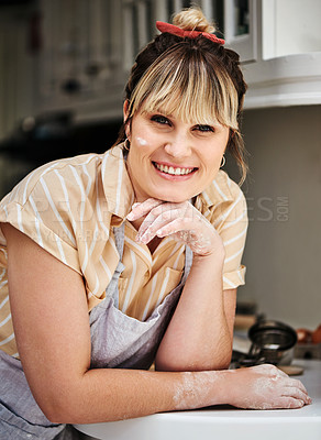Buy stock photo Cropped shot of a woman posing in her kitchen with flour on her face