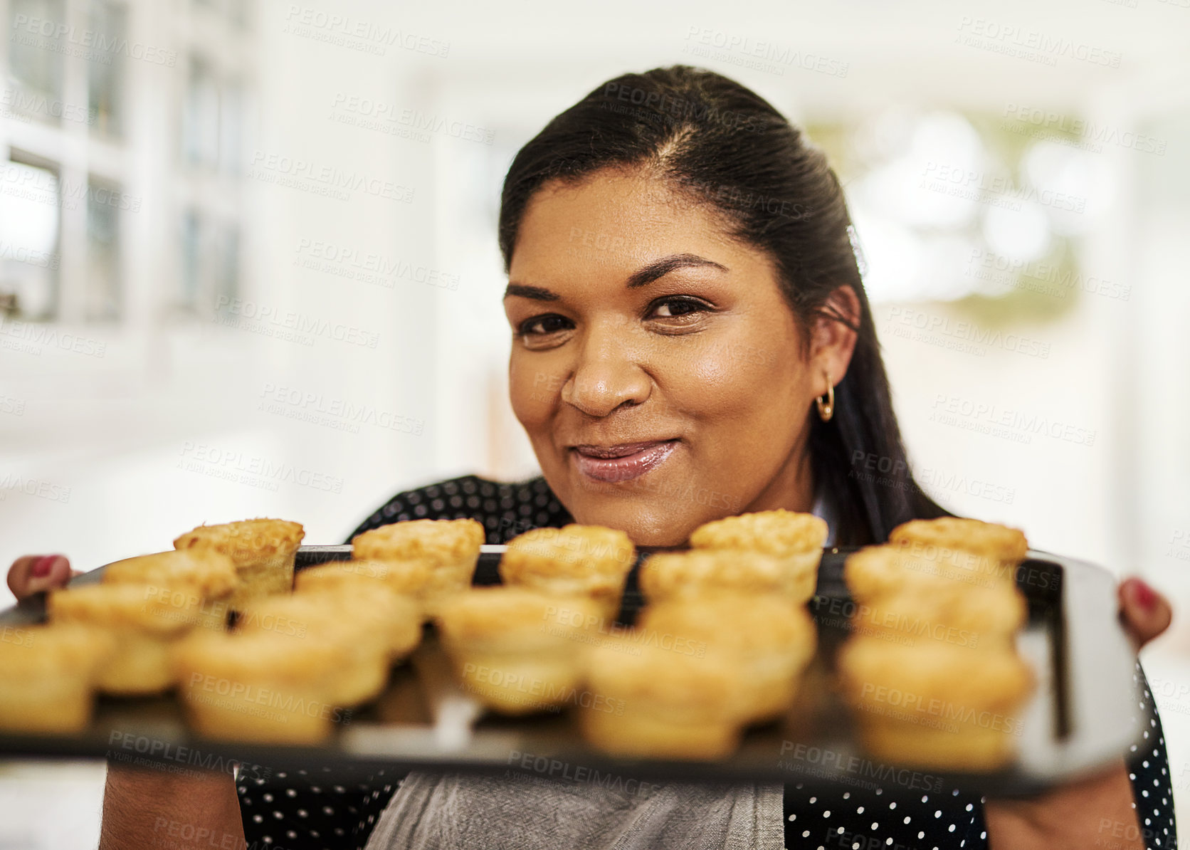 Buy stock photo Cropped shot of a woman holding up freshly baked pies