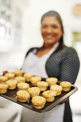 Buy stock photo Cropped shot of a woman holding up freshly baked pies