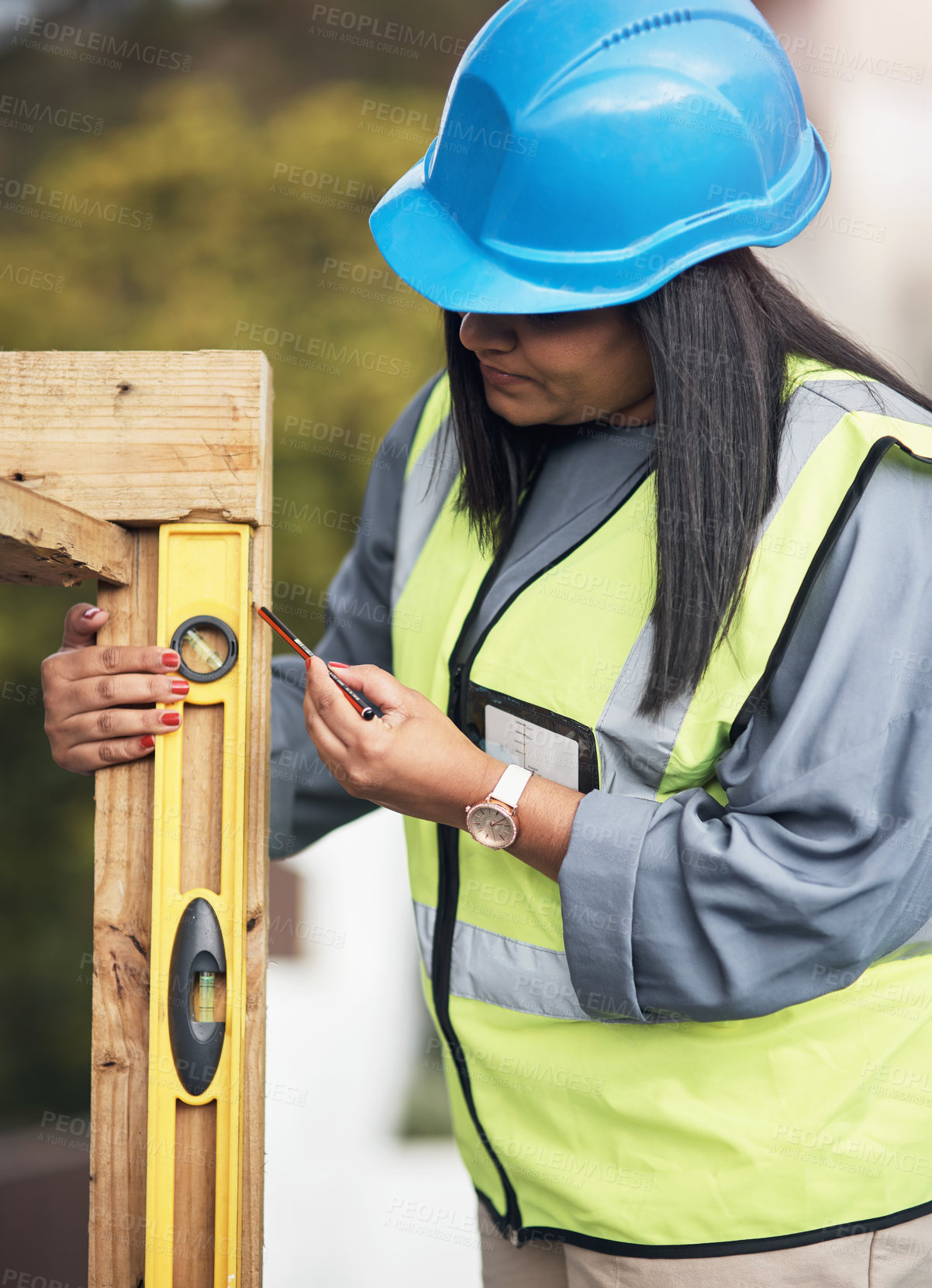 Buy stock photo Cropped shot of an attractive young female construction worker working on site