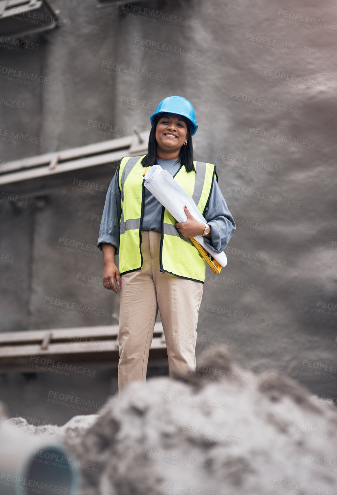 Buy stock photo Cropped portrait of an attractive young female construction worker working on site
